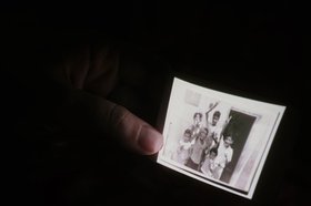 Yasmine Eid-Sabbagh, A photographic conversation from Burj al-Shamali camp - work in progress, part two, Perfomance at Les Halles des Schaerbeek, Brussels, December 2012.