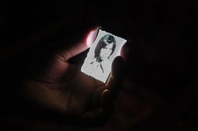 Yasmine Eid-Sabbagh, A photographic conversation from Burj al-Shamali camp - work in progress, part two, Perfomance at Les Halles des Schaerbeek, Brussels, December 2012.