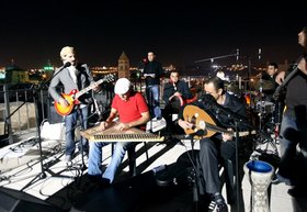 Michael Rakowitz, The Breakup, 2010, performed by Sabreen Band on roof of the Swedish Christian Study Center, Jaffa Gate, Old City, Jerusalem, The Jerusalem Show 2010. Photograph by Rula Halawani. Courtesy of Al-Ma'mal Foundation, Jerusalem.
