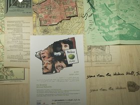 Michael Rakowitz, Detail of Study for The Breakup &ndash; Maps (The Breakup Series), 2010-2012, Beatles map of Liverpool, 1970s; Jerusalem map 1950 printed in Israel printed in Palestine; Jerusalem map, 1936; Michael Rakowitz poster Al Ma'mal, 2010; Brick fragment from Cavern Club, 1963; Stone from the Western Wall, 2010, 2 x 4 ft, 61 x 121.9 cm. Courtesy the artist and Lombard Freid Gallery.