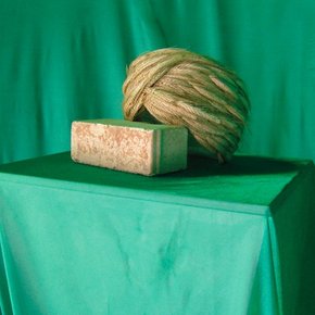 Slavs and Tatars, <i>Wheat Mollah,</i> 2011, wheat, cotton, brick, with wood, brass and glass case, 45 x 145 x 45 cm. Courtesy of the artists. 