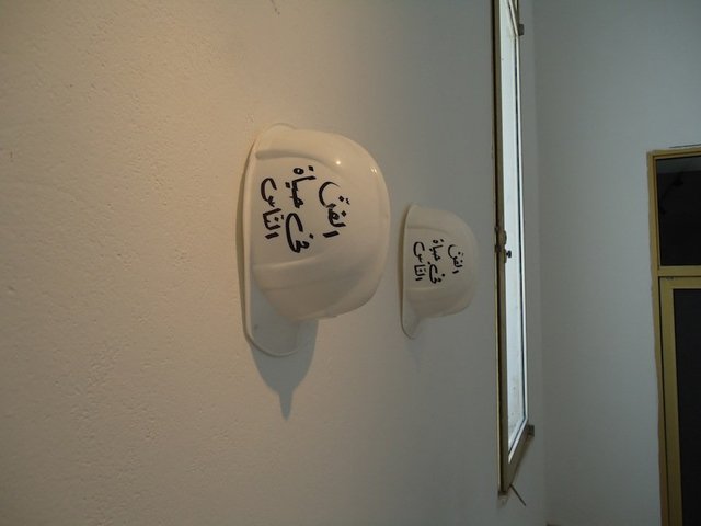 Ayşe Erkmen, Construction, 2012 (2009), calligraphy on builders helmets for an intervention at the Bardo Museum. Courtesy the artist and Galerie Barbara Weiss. Photograph &copy; ATP/Ibraaz Publishing, 2012.