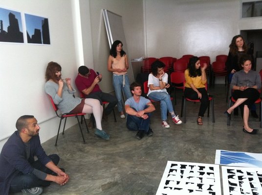<p>Home Workspace Program participants and professors at a critique session, April 2012</p><p>Courtesy of Home Workspace, Beirut</p>&nbsp;