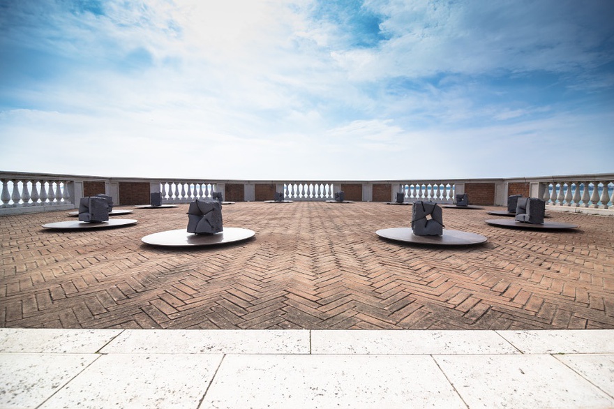 Mikayel Ohanjanyan, Tasnerku, 2015. Mixed size basalt blocks and discs of corten steel, 120 cm each disc. Installation view, Mekhitarist Monastery of San Lazzaro degli Armeni, Venice.