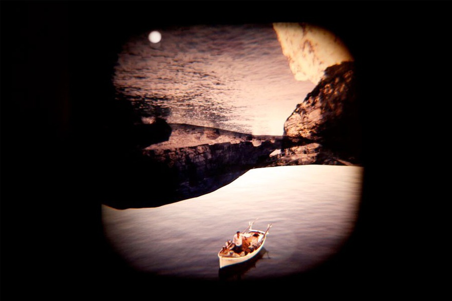 Hajra Waheed, A Short Film 1-321, 2014. Slide detail, negative glass slides, collaged photographs and cut film, walnut shelves, slide viewer, step tools, 7 cm x 7 cm (each). Exhibition detail, Mus&eacute;e d'art contemporain de Montr&eacute;al.